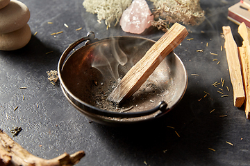 Image showing palo santo stick in cup and staff for magic ritual