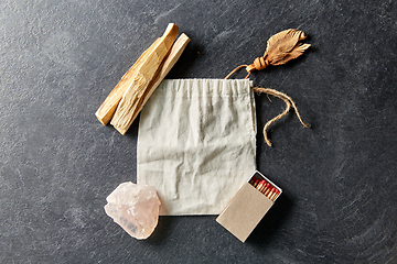 Image showing palo santo sticks, bag, quartz crystal and matches