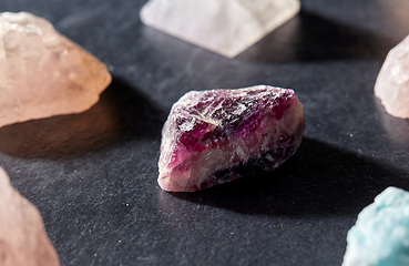 Image showing quartz crystals and gem stones on slate background