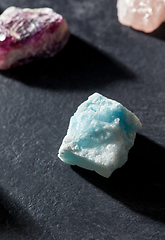 Image showing quartz crystals and gem stones on slate background