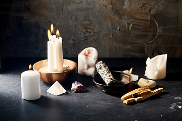 Image showing burning candles and various staff for magic ritual