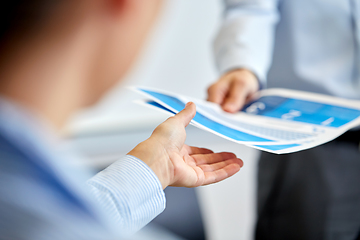 Image showing close up of business team with papers at office