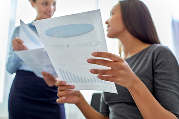 Image showing happy business team with papers meeting at office