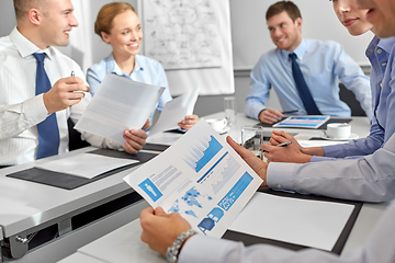 Image showing happy business team with papers meeting at office