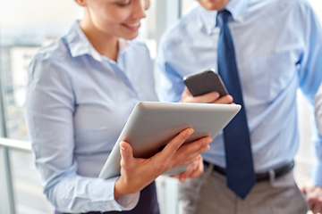 Image showing business team with tablet pc and smartphone