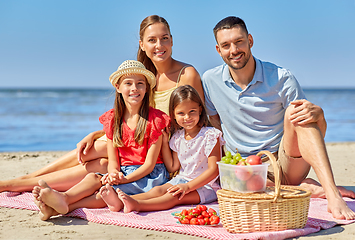 Image showing happy family having picnic on summer beach