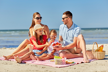 Image showing happy family having picnic on summer beach