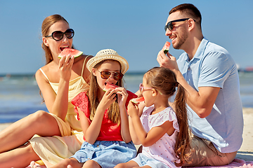 Image showing happy family having picnic on summer beach