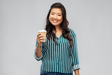 Image showing happy asian woman drinking coffee
