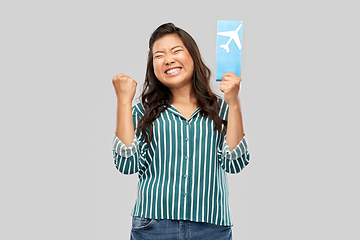 Image showing happy asian woman with air ticket and passport