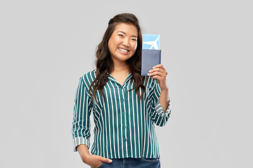 Image showing happy asian woman with air ticket and passport