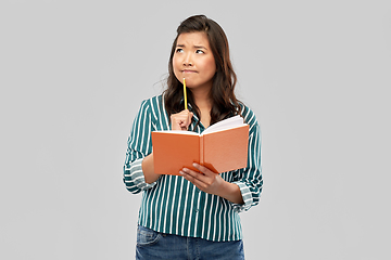 Image showing asian student woman with diary and pencil