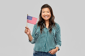 Image showing happy asian woman with flag of america