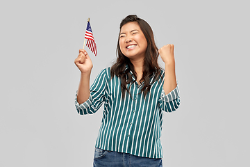 Image showing happy asian woman with flag of america