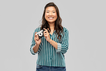 Image showing asian female photographer with digital camera