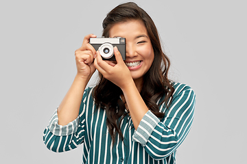 Image showing asian female photographer with digital camera