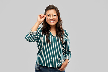 Image showing happy asian woman in glasses or student