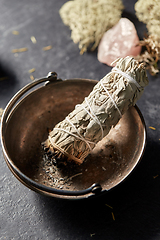 Image showing white sage in cup and staff for magic ritual