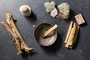 Image showing palo santo stick in cup and staff for magic ritual