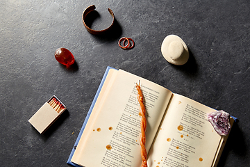 Image showing magic book, wax candle, matches and gem stones