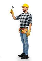 Image showing happy male worker or builder in helmet with hammer