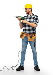 Image showing happy male worker or builder in helmet with drill