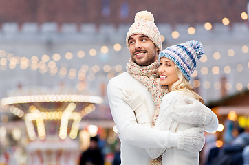 Image showing couple in winter hugging over christmas market