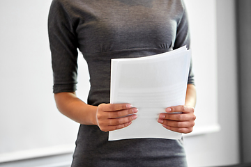 Image showing close up of businesswoman with papers at office