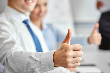 Image showing close up of businessman showing thumbs up