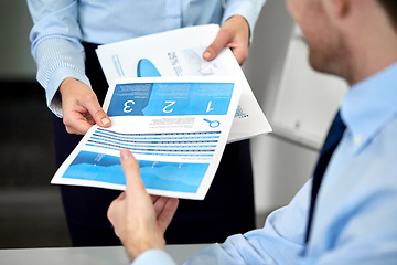 Image showing close up of business team with papers at office