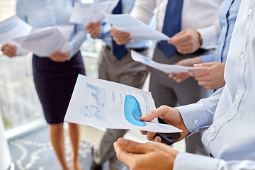 Image showing business team with papers meeting at office