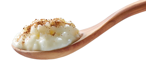 Image showing rice milk pudding in a wooden spoon