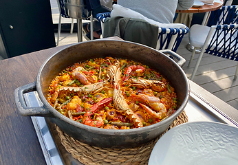 Image showing Traditional Paella served at restaurant in Marbella, Spain