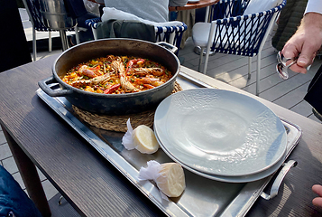 Image showing Traditional Paella served at restaurant in Marbella, Spain