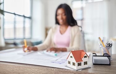 Image showing house model and female architect working at office