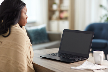 Image showing sick woman having video call on laptop