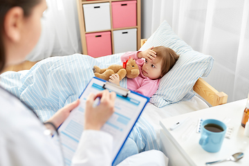 Image showing doctor with clipboard and sick girl in bed at home