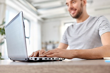 Image showing man with laptop working at home office