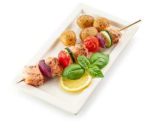 Image showing plate of salmon and vegetable skewer