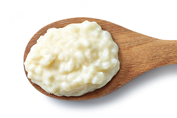 Image showing wooden spoon of rice pudding