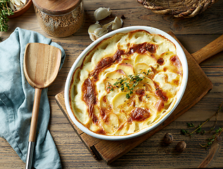 Image showing bowl of freshly baked potato gratin