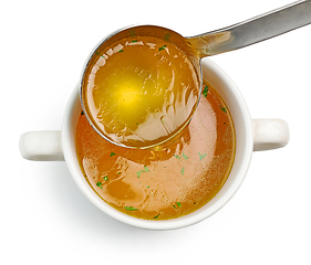 Image showing chicken broth pouring into bowl