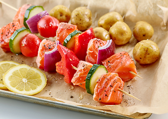 Image showing raw salmon and vegetable skewers