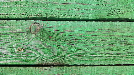 Image showing Texture of weathered wooden green painted fence