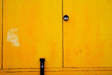 Image showing bright yellow building wall surface with room for text 