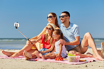 Image showing happy family taking selfie on summer beach