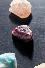 Image showing quartz crystals and gem stones on slate background