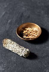 Image showing white sage and cup with burnt matches