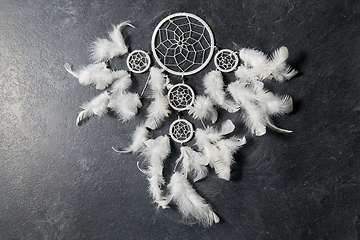 Image showing dreamcatcher on dark slate stone background