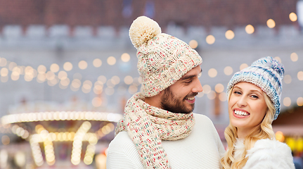 Image showing couple in winter clothes at christmas market